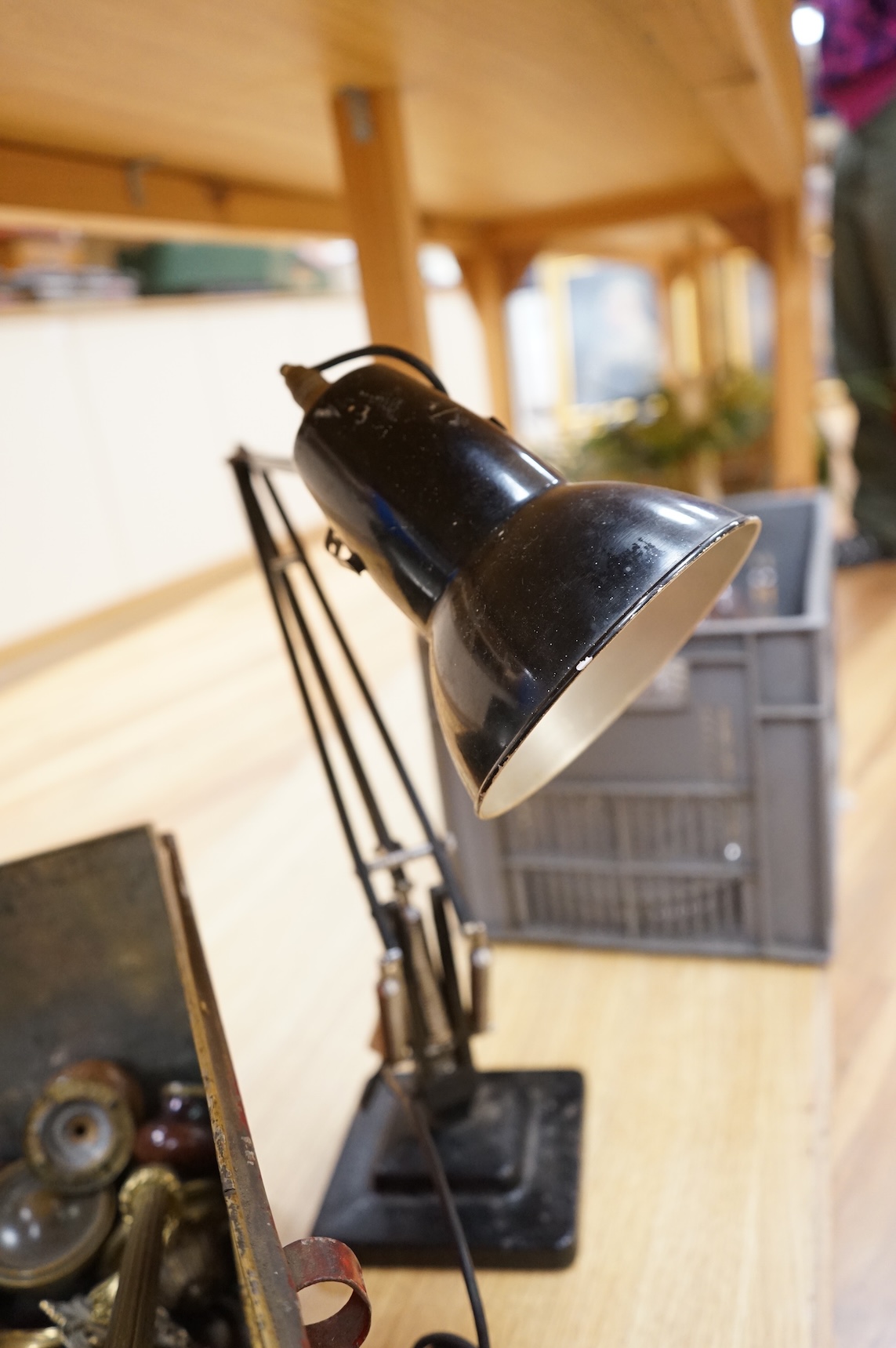 An Anglepoise lamp and metal door furniture and fittings in a tin trunk